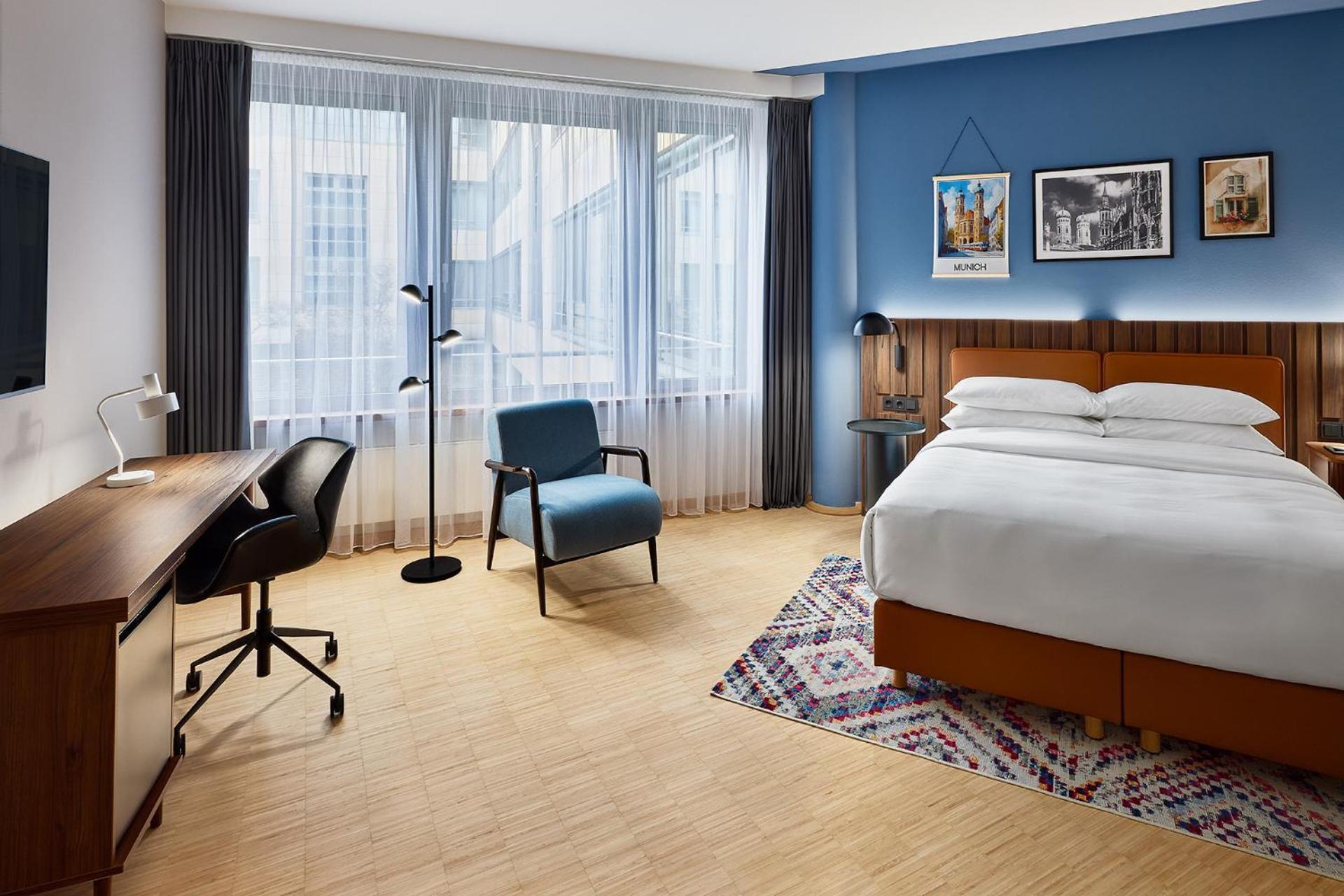 Premium Zimmer mit Queensize-Bett und Küchenzeile
